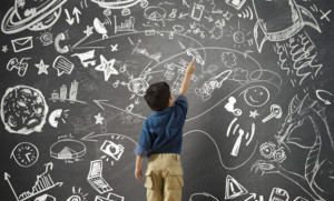 A Child Standing Before a Chalkboard of Opportunity and Adventures - will help him to Prepare for College