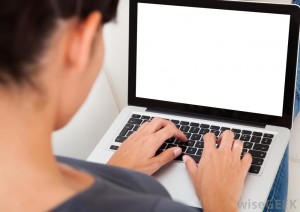 dark-haired-woman-typing-on-laptop